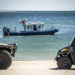 A police boat just off the beach in Ipswich, Massachusetts.